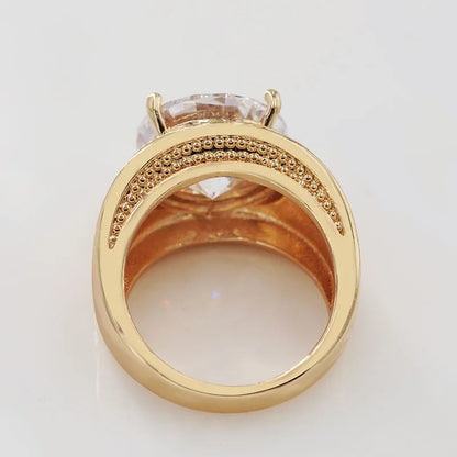 AUKSINĖS SPALVOS ŽIEDAS SU DIDELIU APVALIU CIRKONIU