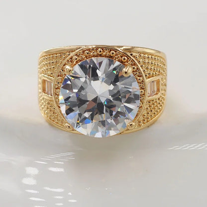 AUKSINĖS SPALVOS ŽIEDAS SU DIDELIU APVALIU CIRKONIU